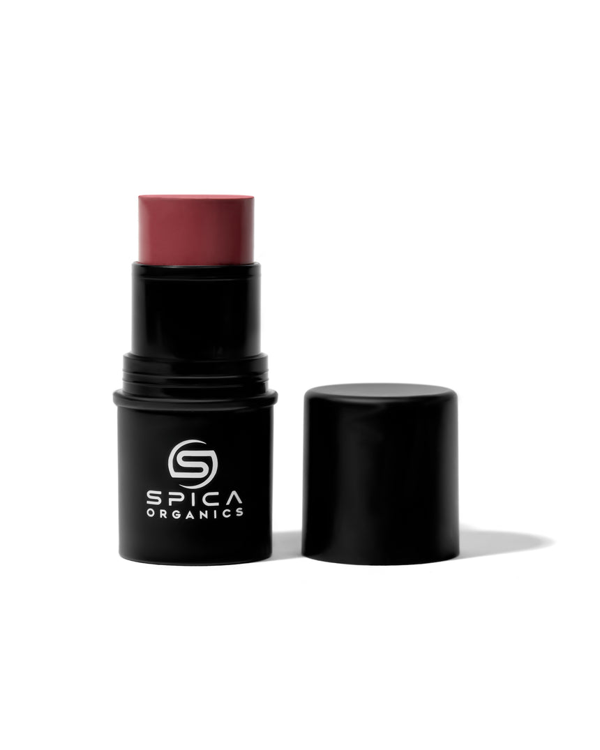 Spica Organics lipstick stick with black case on a white background
