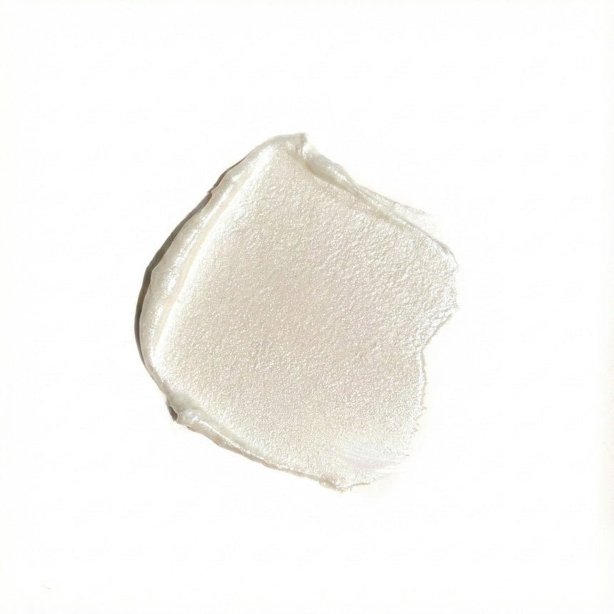 Close-up of a beige makeup swatch on a white background
