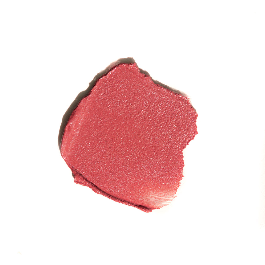 Pink makeup swatch on a white background