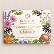 Spica Organics gift card with nature-themed design on a textured beige background