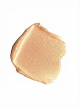 Close-up of a beige makeup swatch on a white background