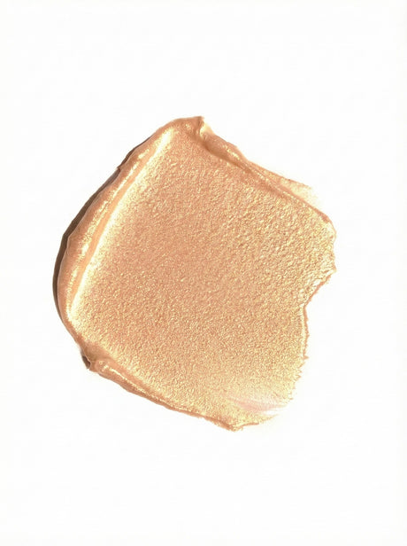Close-up of a beige makeup swatch on a white background
